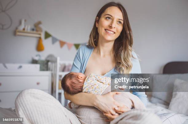 breastfeeding mother - feeding stock pictures, royalty-free photos & images
