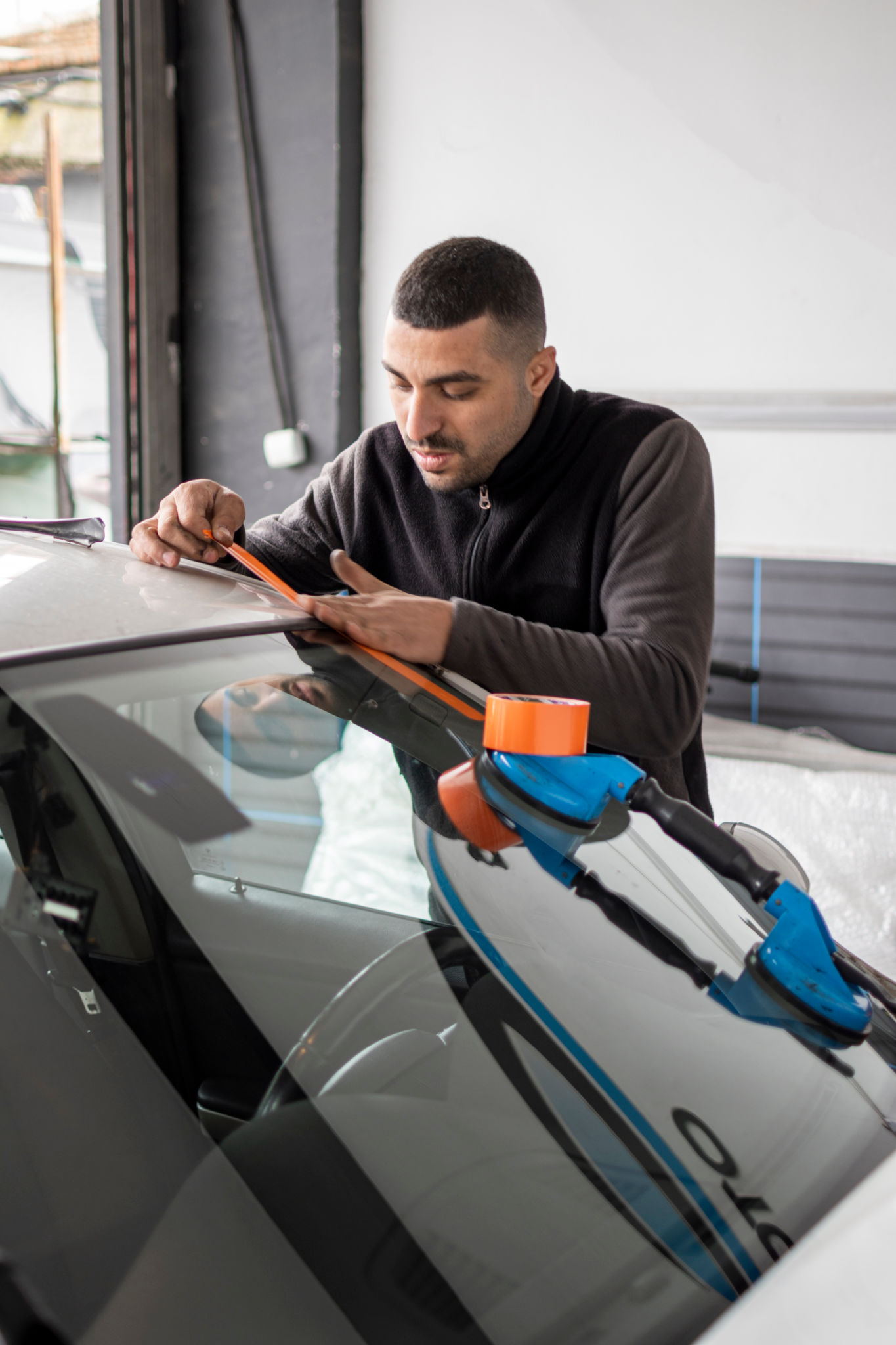 technician replacing windscreen