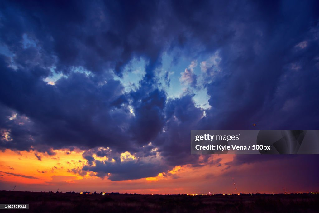Scenic view of dramatic sky over land during sunset,United States,USA