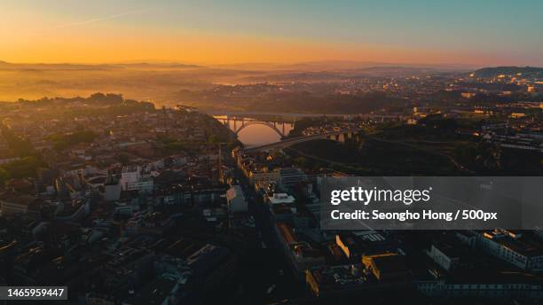 high angle view of illuminated cityscape against sky during sunset,porto,portugal - distrito do porto portugal imagens e fotografias de stock