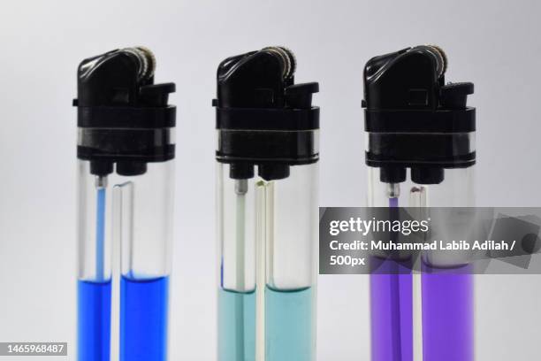 close-up of syringe against white background,indonesia - lighter spark stock pictures, royalty-free photos & images