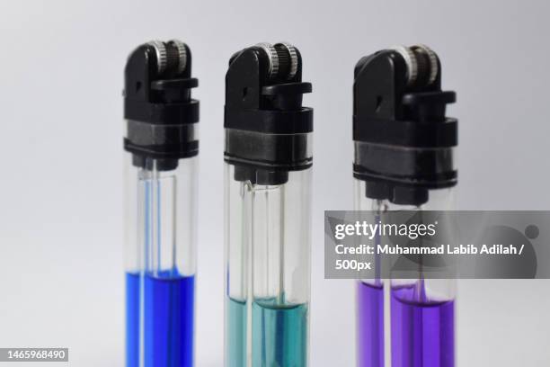 close-up of test tubes against white background,indonesia - lighter spark stock pictures, royalty-free photos & images