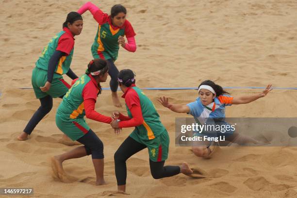 Priyanka Negi of India is tackled as she competes during the Beach Kabaddi Women's Team Group A match between India and Bangladesh on Day 4 of the...