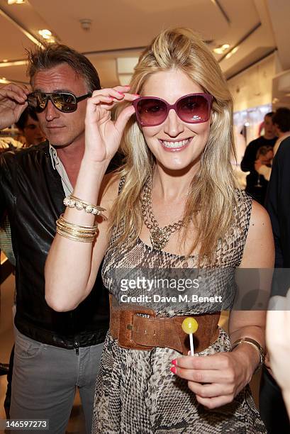 David Ginola and Francesca Hull try on sunglasses at the launch of Lacoste's new London Flagship store in Knightsbridge on June 20, 2012 in London,...
