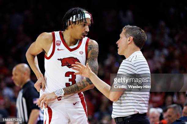 Nick Smith Jr. #3 talks with Head Coach Eric Musselman of the Arkansas Razorbacks during a game against the Mississippi State Bulldogs at Bud Walton...