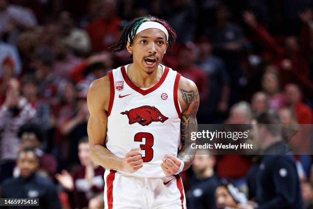 Nick Smith Jr. #3 of the Arkansas Razorbacks gets excited during a game against the Mississippi State Bulldogs at Bud Walton Arena on February 11,...