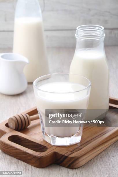 close-up of milk in milk on table,bekasi city,west java,indonesia - bacteria cultures stock pictures, royalty-free photos & images