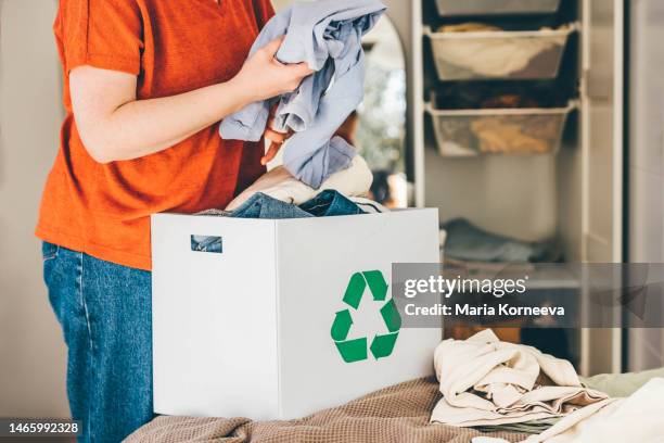 recycle clothes concept. recycling box full of clothes. - clear donation box stock pictures, royalty-free photos & images