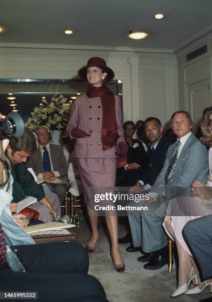 Model wearing a classic two-piece suit from Gustave Tassell's autumn and winter collection for the House of Norell at a New York fashion show on...