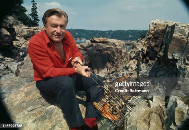 Former New York Governor Nelson Rockefeller enjoys a lobster cookout during a vacation in Seal Harbor, Maine, on August 18th, 1974.