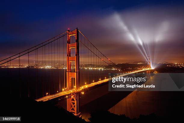 golden gate bridge - searchlight stock pictures, royalty-free photos & images