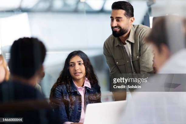 teacher with teenage students in class - arab teen photos et images de collection