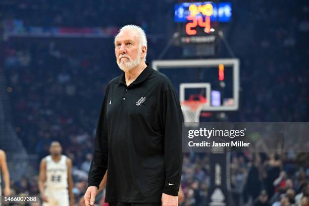 Head coach Gregg Popovich of the San Antonio Spurs walks on to the court for a time out during the first quarter against the Cleveland Cavaliers at...