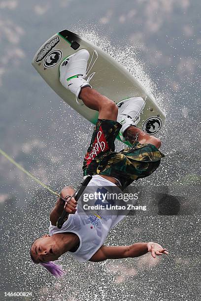 Ho Lung Cheung of Hong Kong competes in the Men's Wakeboard Quarterfinal Heat 3 during the Day 4 of the 3rd Asian Beach Games Haiyang 2012 at Zone of...