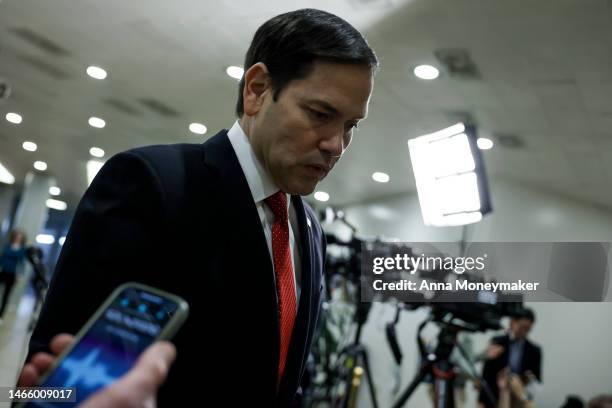 Sen. Marco Rubio speaks to a reporter while walking to a briefing at the U.S. Capitol Building on February 14, 2023 in Washington, DC. Officials from...