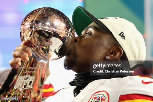 Jerick McKinnon of the Kansas City Chiefs celebrates with the the Vince Lombardi Trophy after defeating the Philadelphia Eagles in Super Bowl LVII at...