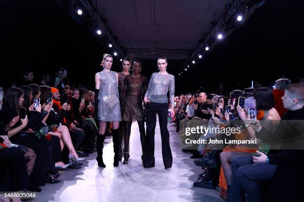 Models walk the runway wearing Naeem Khan during New York Fashion Week 2023 on February 14, 2023 in New York City.