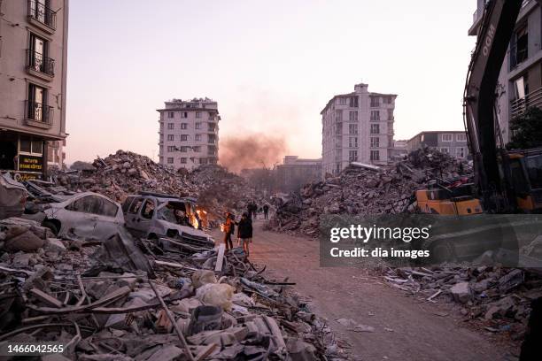 Rescue workers walk along an area damaged after the earthquake on February 14, 2023 in Hatay, Türkiye. The death toll from a catastrophic earthquake...