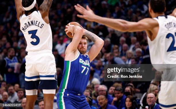 Luka Doncic of the Dallas Mavericks looks to pass against the Minnesota Timberwolves in the second half at American Airlines Center on February 13,...