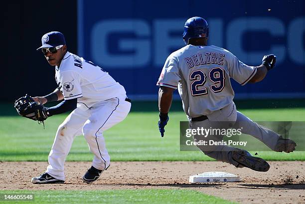 Adrian Beltre of the Texas Rangers slides into second base as Alexi Amarista of the San Diego Padres tries to turn a double play during the sixth...