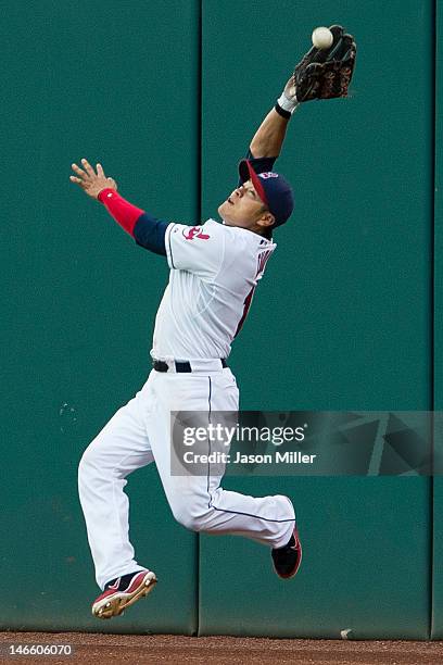 Right fielder Shin-Soo Choo of the Cleveland Indians grabs a fly ball during the fifth inning against the Cincinnati Reds during interleague play at...