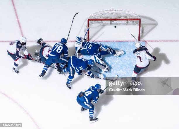 Sean Kuraly of the Columbus Blue Jackets scores against Joseph Woll of the Toronto Maple Leafs during the second period at the Scotiabank Arena on...