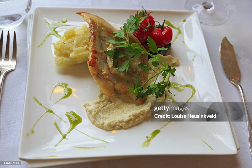 Turbot with mash and tomatoes