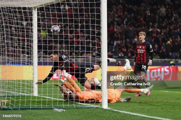 Brahim Diaz of AC Milan scores the team's first goal past Fraser Forster of Tottenham Hotspur during the UEFA Champions League round of 16 leg one...