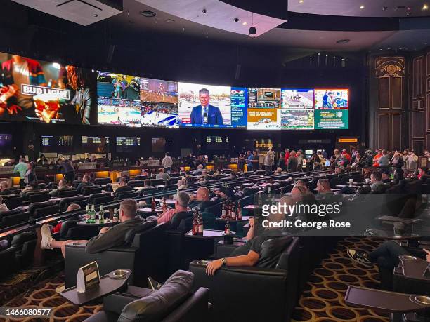 Gamblers jam into Caesars Sports Book at Caesars Palace Hotel & Casino to watch and bet on the Kansas City Chiefs vs Philadelphia Eagles in the...
