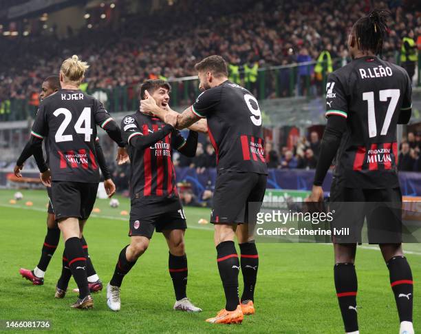 Brahim Diaz of AC Milan celebrates with teammate Olivier Giroud after scoring the team's first goal during the UEFA Champions League round of 16 leg...