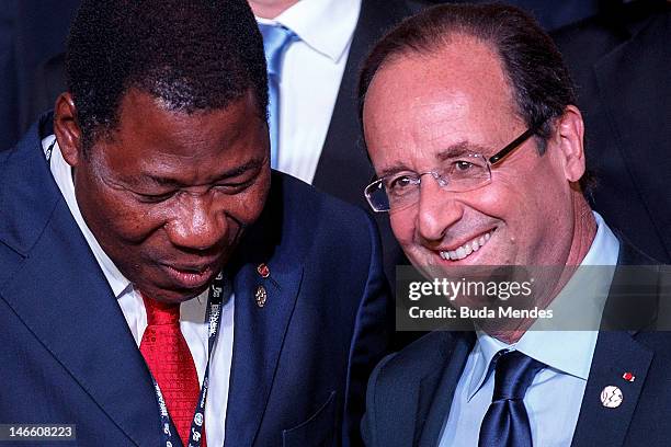 Benin's President Boni Yayi speaks with France's President Francois Hollande, during the UN Conference on Sustainable Development Rio+20 family...