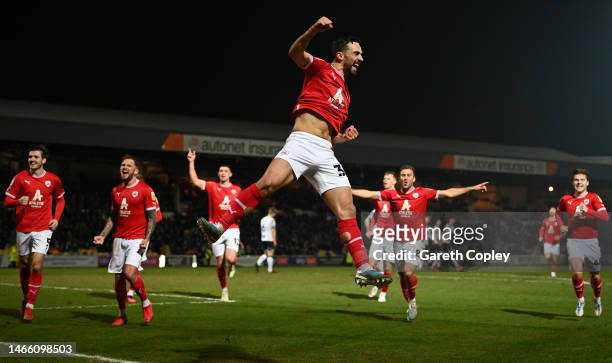 Adam Phillips of Barnsley celebrates scoring his team's third goal during the Sky Bet League One between Port Vale and Barnsley at Vale Park on...