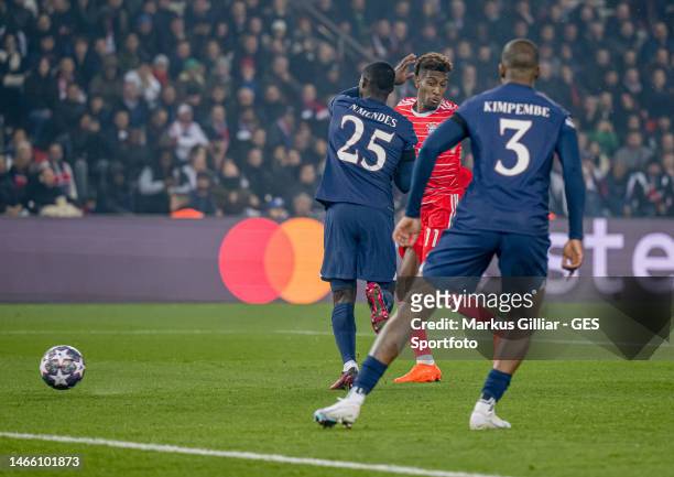 Kingsley Coman of Bayern scores his team's first goal past Nuno Mendes of Paris during the UEFA Champions League round of 16 leg one match between...