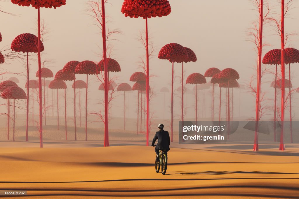 Businessman cycling in strange surreal landscape