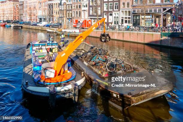 heap of bicycles fished out of an amsterdam canal - claw machine bildbanksfoton och bilder