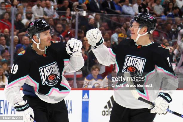 Brady Tkachuk of the Ottawa Senators congratulates his brother Matthew Tkachuk of the Florida Panthers on his goal during the 2023 NHL All-Star Game...
