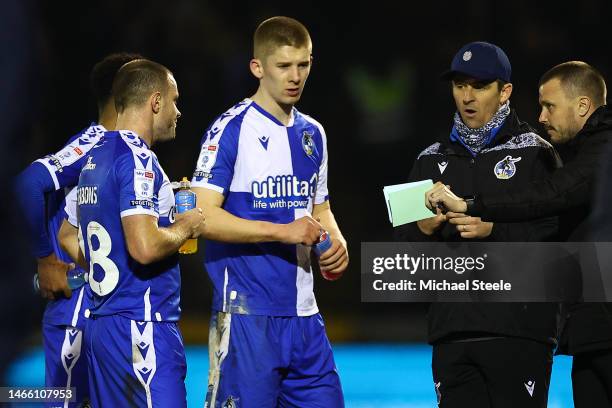 Joey Barton the manager of Bristol Rovers in conversation with James Gibbons and Josh Coburn during the Sky Bet League One between Bristol Rovers and...