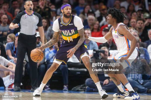 Jalen Williams of the Oklahoma City Thunder defends Brandon Ingram of the New Orleans Pelicans during the fourth quarter at Paycom Center on February...