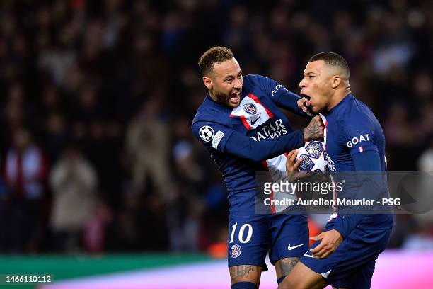 Kylian Mbappe of Paris Saint-Germain is congratulated by Neymar Jr after scoring during the UEFA Champions League round of 16 leg one match between...