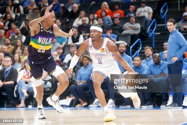 Shai Gilgeous-Alexander of the Oklahoma City Thunder drives past Trey Murphy III of the New Orleans Pelicans during the third quarter at Paycom...