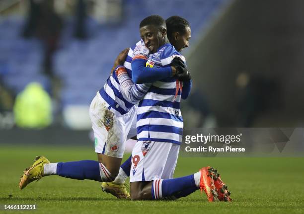 Tyrese Fornah celebrates with Femi Azeez of Reading after the final whistle of the Sky Bet Championship match between Reading and Rotherham United at...