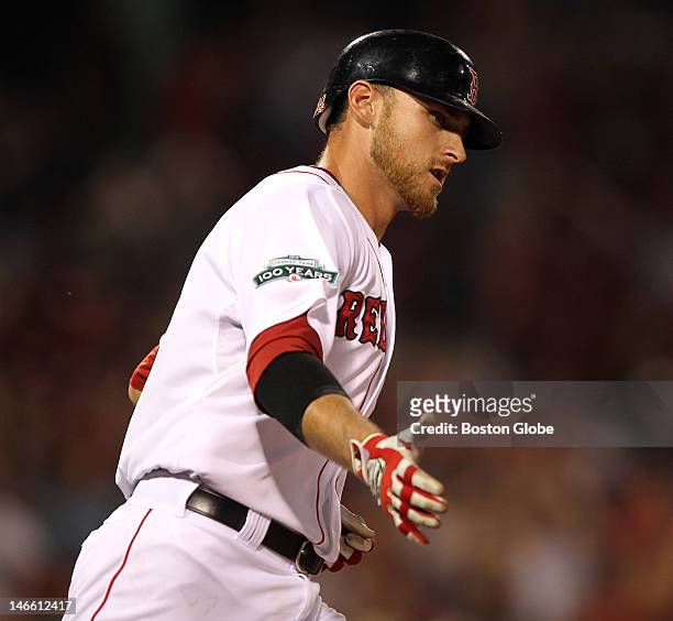 Boston Red Sox third baseman Will Middlebrooks rounds first on his way to touching them all after his two run homer in the eighth inning as the...