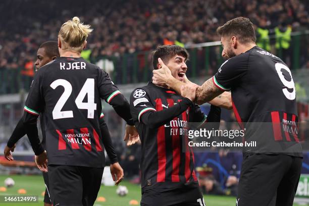 Brahim Diaz of AC Milan celebrates with teammate Olivier Giroud after scoring the team's first goal during the UEFA Champions League round of 16 leg...