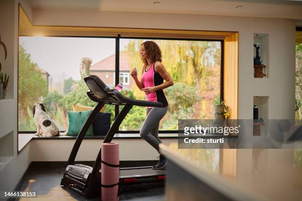 home workout - running woman woman stock pictures, royalty-free photos & images