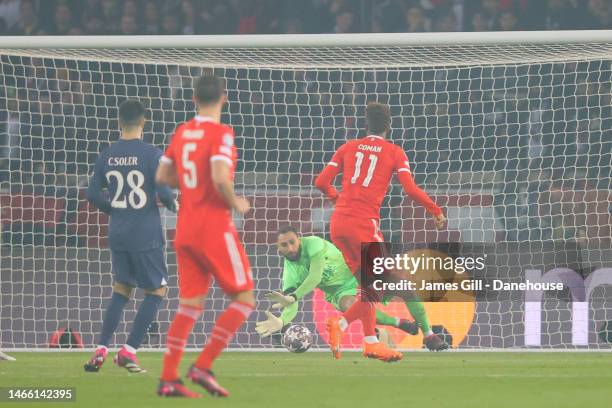 Kingsley Coman of Bayern Munich scores his side's first goal past Gianluigi Donnarumma of PSG during the UEFA Champions League round of 16 leg one...