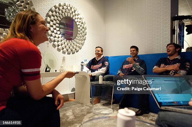 Cave Dweller Lindsay Guentzel calls her father to say hello with Minnesota Twins Matt Capps, Joe Mauer and Liam Hendriks during their visit to the...