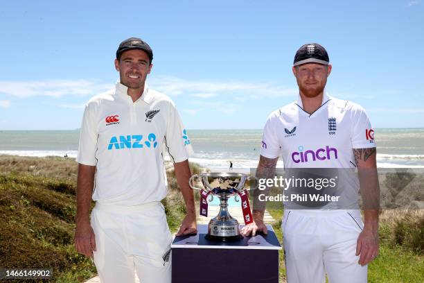 New Zealand Blackcaps captain Tim Southee and England captain Ben Stokes pose with the trophy on the Mount Maunganui beach during a media opportunity...