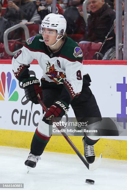 Clayton Keller of the Arizona Coyotes skates with the puck against the Chicago Blackhawks during the third period at United Center on February 10,...