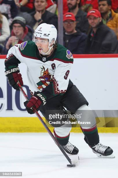 Clayton Keller of the Arizona Coyotes skates with the puck against the Chicago Blackhawks during the third period at United Center on February 10,...