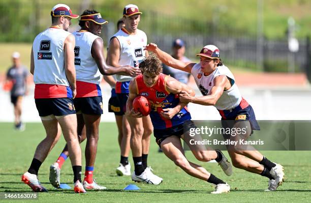 Deven Robertson breaks away from the defence during a Brisbane Lions AFL training session at Brighton Homes Arena on February 15, 2023 in Brisbane,...